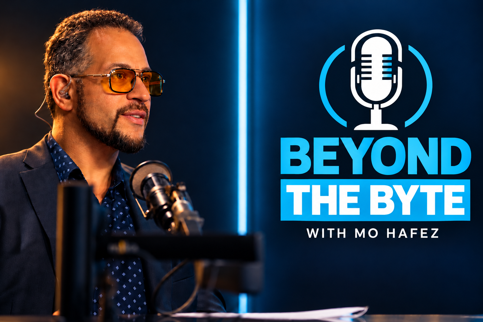 Color-graded portrait of Mo Hafez at the podcast microphone beside blue and white Beyond the Byte branding